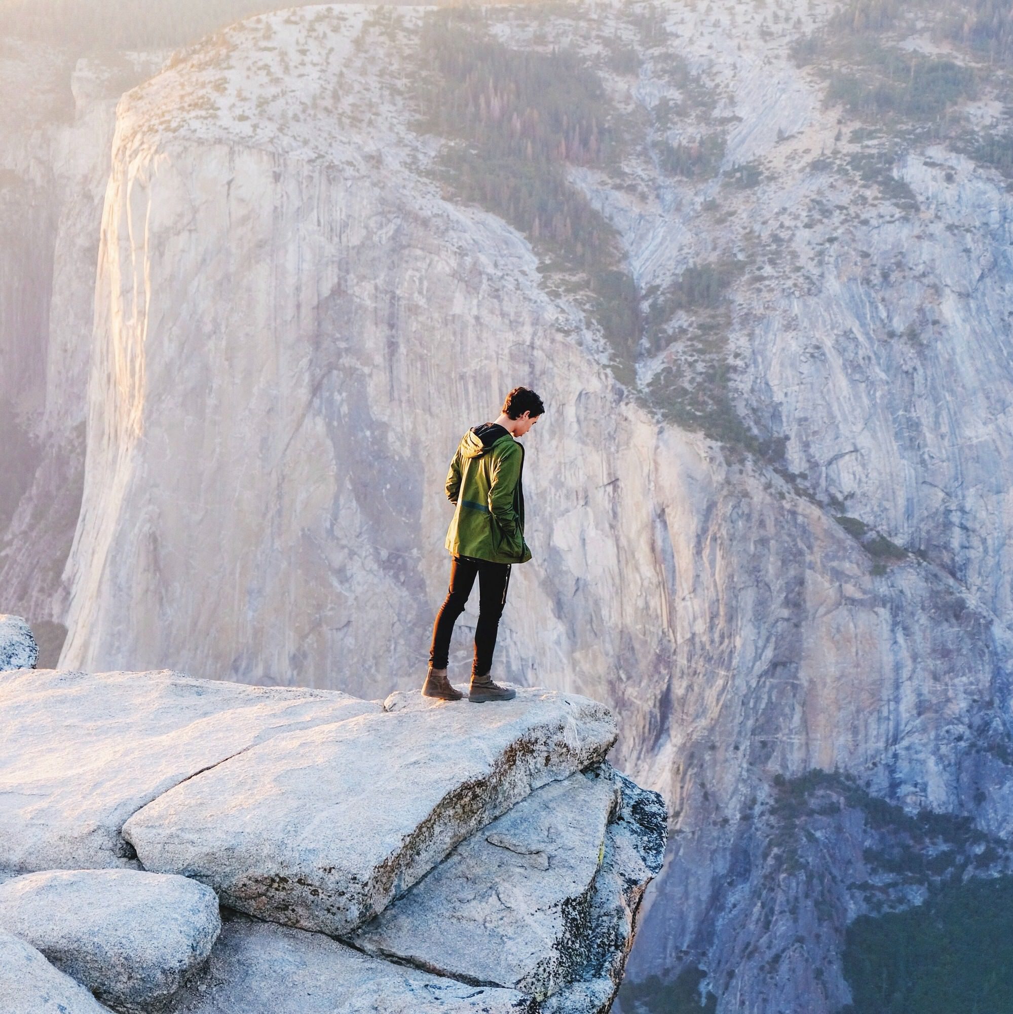 Person standing on the edge of a cliff
