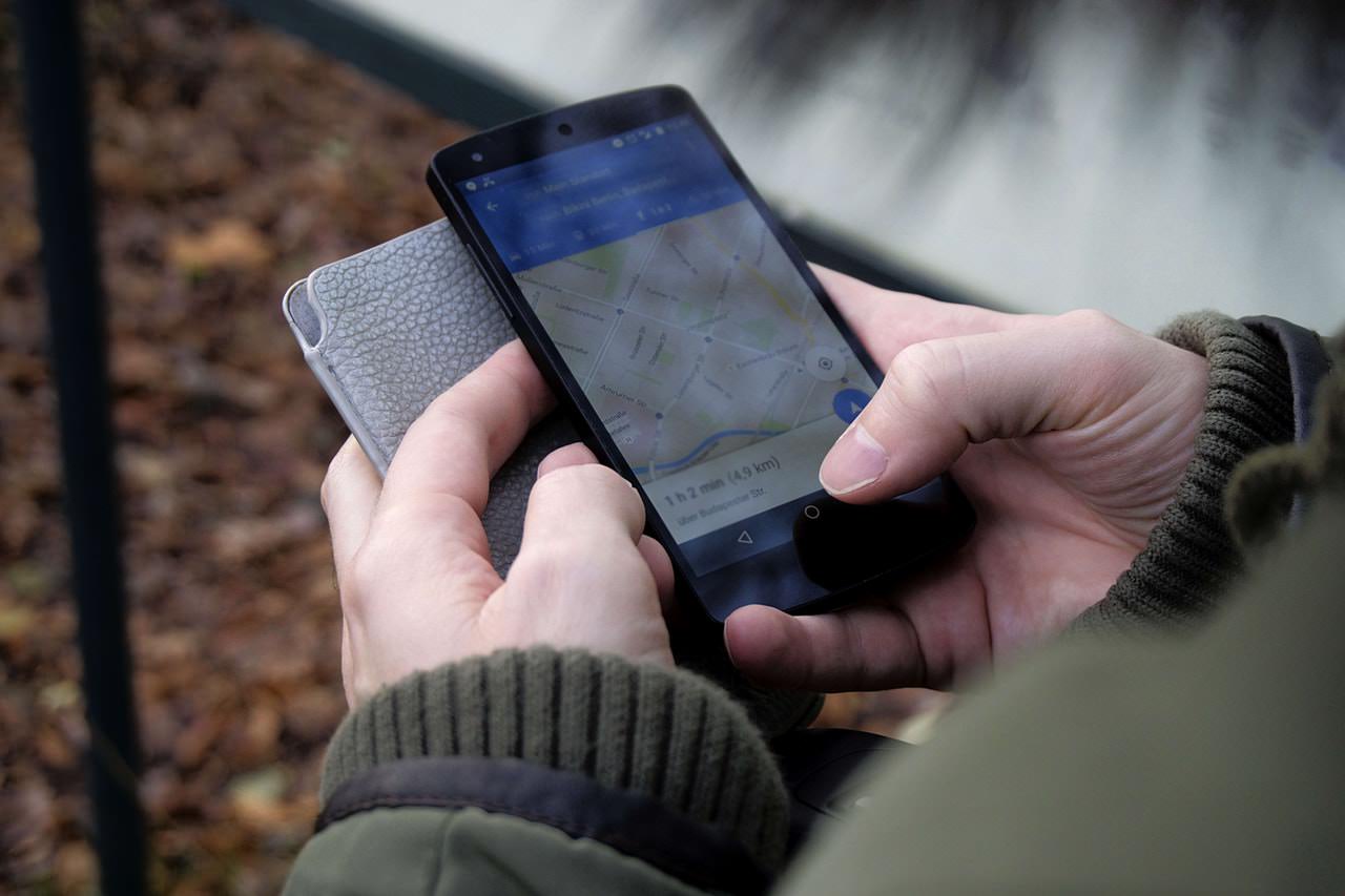 Person conducting a mobile search on Google Maps